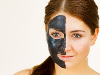 Woman with charcoal facial mask