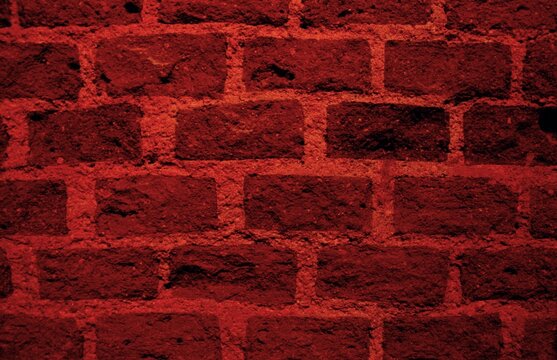 Fondo de escritorio rojo y negro de una pared de ladrillos. Trabajo creativo transformando fotograf&iacute;as digitalmente.