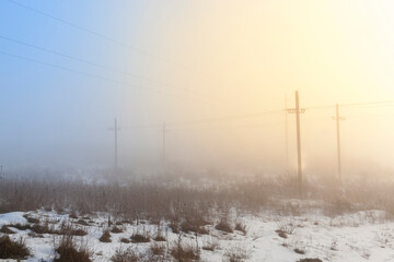 electric poles in the winter season, installed in the field