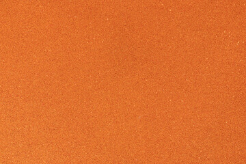 Orange texture with micro-relief and glitter. Orange background with texture