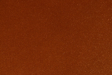 Orange texture with sparkles and and a shadow from the top right corner. Sparkling stars effect...