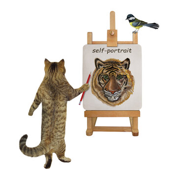 A beige cat artist with a pencil paints his self-portrait on a canvas on an easel. White background. Isolated.