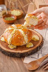 Korean Garlic bread consists of bread topped with garlic and olive oil or butter and may include additional herbs, such as oregano or chives. It is then either grilled in bread oven.