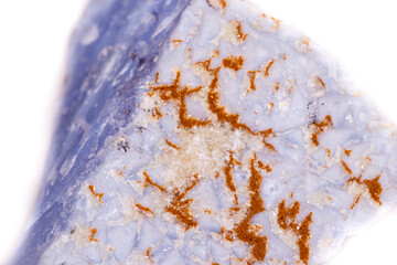 Macro mineral blue agate in the rock on white background