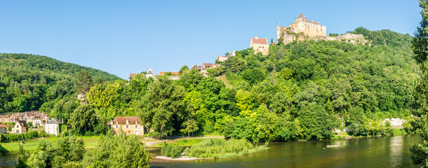 Fototapeta na wymiar Panoramic view at the Castle of Castelnaud-la-Chapelle with village near Dordogne river - France