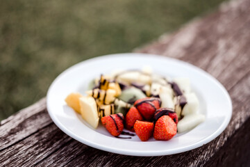 Delicious fruit salad with chocolate topping
