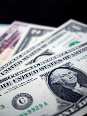 In this photo illustration background of various dollar bills