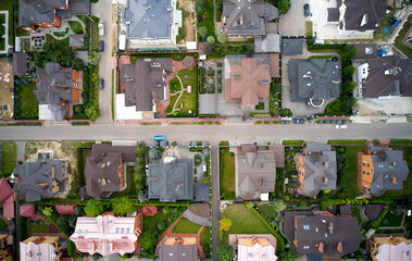 Aerial of real estate in suburban area. Top down shot directly above buildings