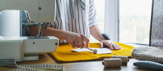 Sewing. Recycling Made by hand from home. sewing machine project quarantine, lockdown. home sewing,Hobby, meditation,zero waste,recycling. Girl sews clothes home sewing machine, ecology zero waste