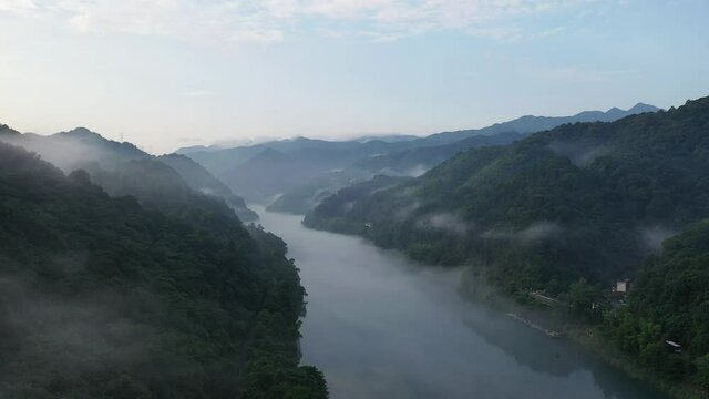 aerial video of the misty river landscape in early morning, fog over the little Dongjiang river, northeast of Chenzhou City, Hunan Province, China.