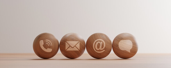 contact us icons print screen on wooden sphere such as call mail address and message for customer...