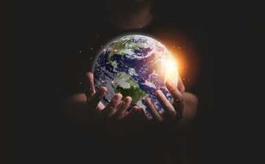 Earth inside of two hands for earth day and saving energy environment concept ,Element of this image from NASA and 3d render.