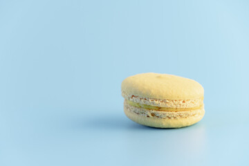 Sweet french macaroons cake pastel colored or macarons with vintage pastel blue colored background