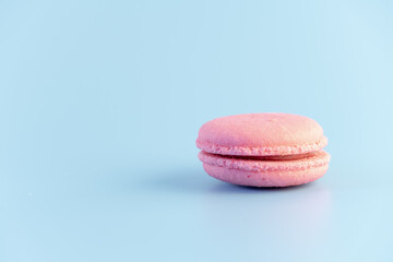 Sweet french macaroons cake pastel colored or macarons with vintage pastel blue colored background