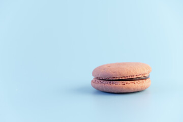 Sweet french macaroons cake pastel colored or macarons with vintage pastel blue colored background