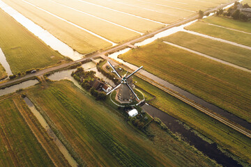 Aerial shot of a classic Dutch windmill in Aarlanderveen, The Netherlands.