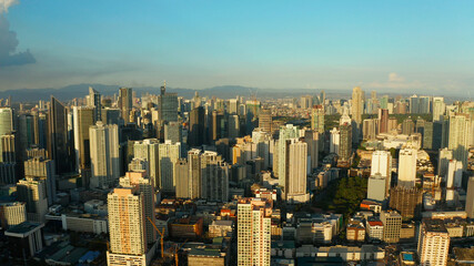 Obraz premium Aerial view of Panorama of Manila city. Skyscrapers and business centers in a big city. Travel vacation concept