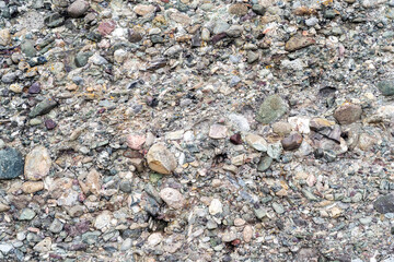 real natural surface texture of stone rock mountain formation consisting of stones and pebbles fastened together
