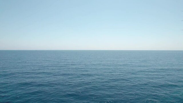 The endless horizon below us, only the blue depths.