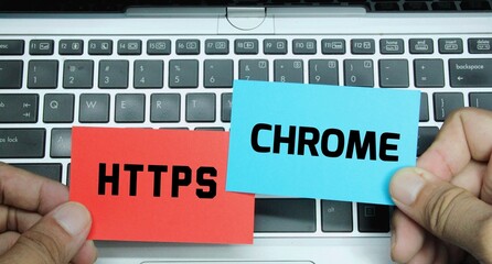 laptop, colored paper with the words Https and Chrome