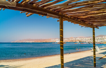 Sandy beach and relaxing atmosphere at central public beach in Eilat - famous tourist resort and...