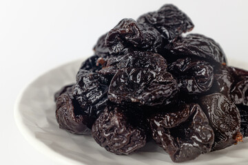 dried plums on a white background
