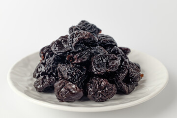 dried plums on a white background