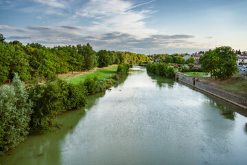 Fototapeta premium River Aude in Carcassonne, France. Green river banks and calm stream.