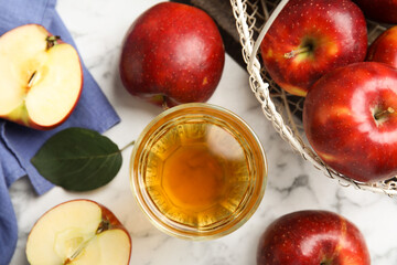Flat lay composition with delicious apple cider on white marble table