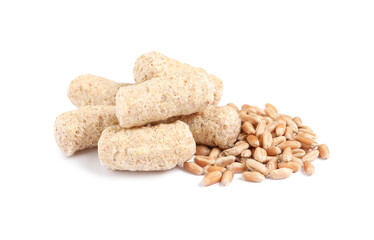 Granulated wheat bran and kernels on white background