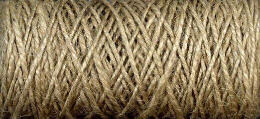 A spool of canvas rope. Texture with shadows