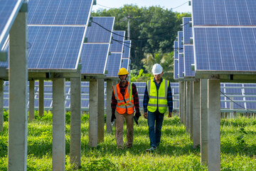 Engineer and electrician inspect solar panel at solar power plant,Engineer working on replacement...