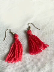 red ear ring from rope