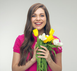 Smiling woman in red dress holding tulips flowers.