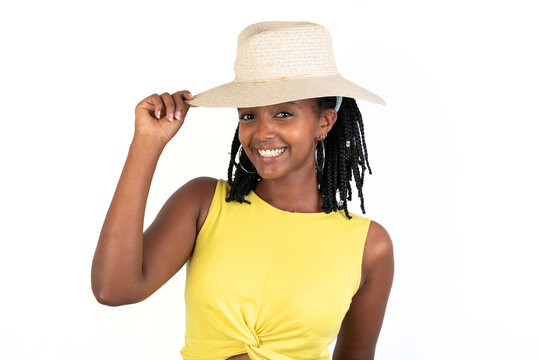 Woman with a hat ready to go to the beach. White background. African-Ethiopian black woman.