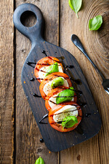 Italian caprese salad on a cutting board