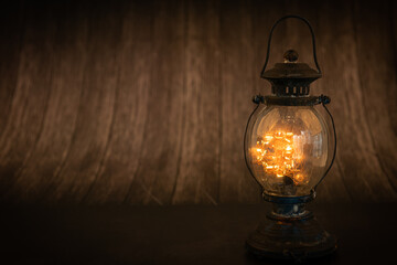 Fototapeta na wymiar Vintage lamps are shining on the dark vintage tree floor.