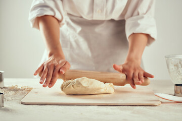 rolling dough on the table flour products kitchen work