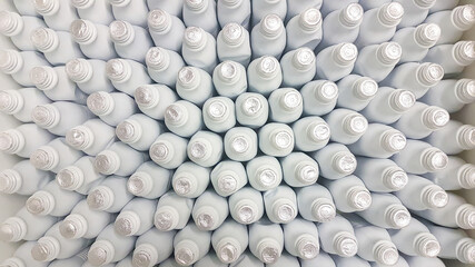 many white plastic bottles lined up