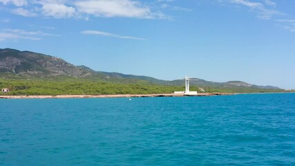 ALCOSSEBRE, SPAIN - Jul 26, 2021: A modern white lighthouse near the sea in Alcossebre, Spain
