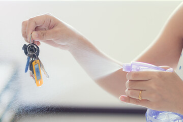 Key plastic credit card disinfection. Protection against coronavirus covid-19 pandemic. Sanitizer disinfector spray. Prevention infection. Cleaning hand cleaning surface. Safety regulations antiseptic