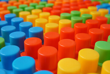 Plastic building blocks pattern background, Colored toy bricks for kid, Close up