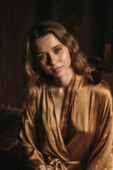 Fototapeta premium Young attractive female sitting with butterfly on her shoulder