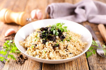 bowl of mushroom risotto and parsley