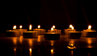 candles that are lit in the dark