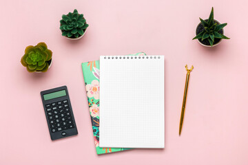 Fashion feminine home office workplace. Notebook, calculator, notepad, golden pen, succulent on pink background Top view Flat lay Freelance work, business, Financial literacy training concept