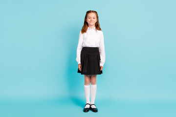 Full length body size view of attractive cheerful girl wearing uniform isolated over bright blue color background