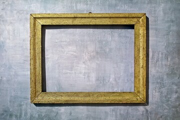 Vintage golden frame on a blue-grey background.