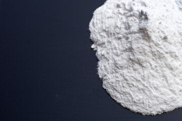 Baking soda on dark background.