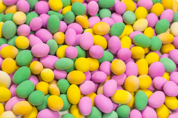 Group of colorful peanuts in glaze.